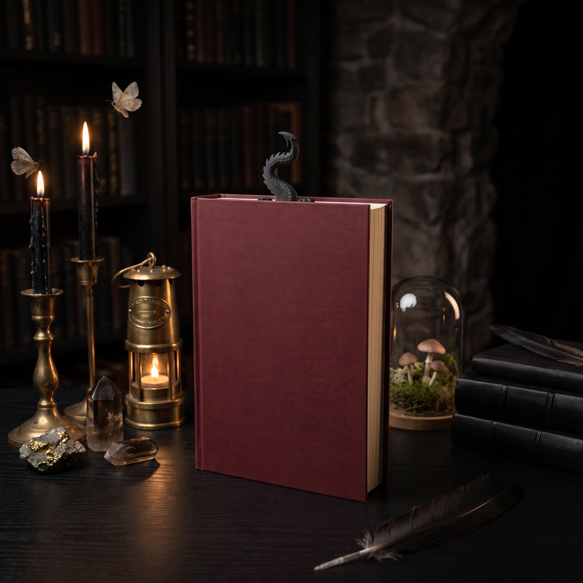 Dragon Tail 3D-printed bookmark in a dark candlelit study