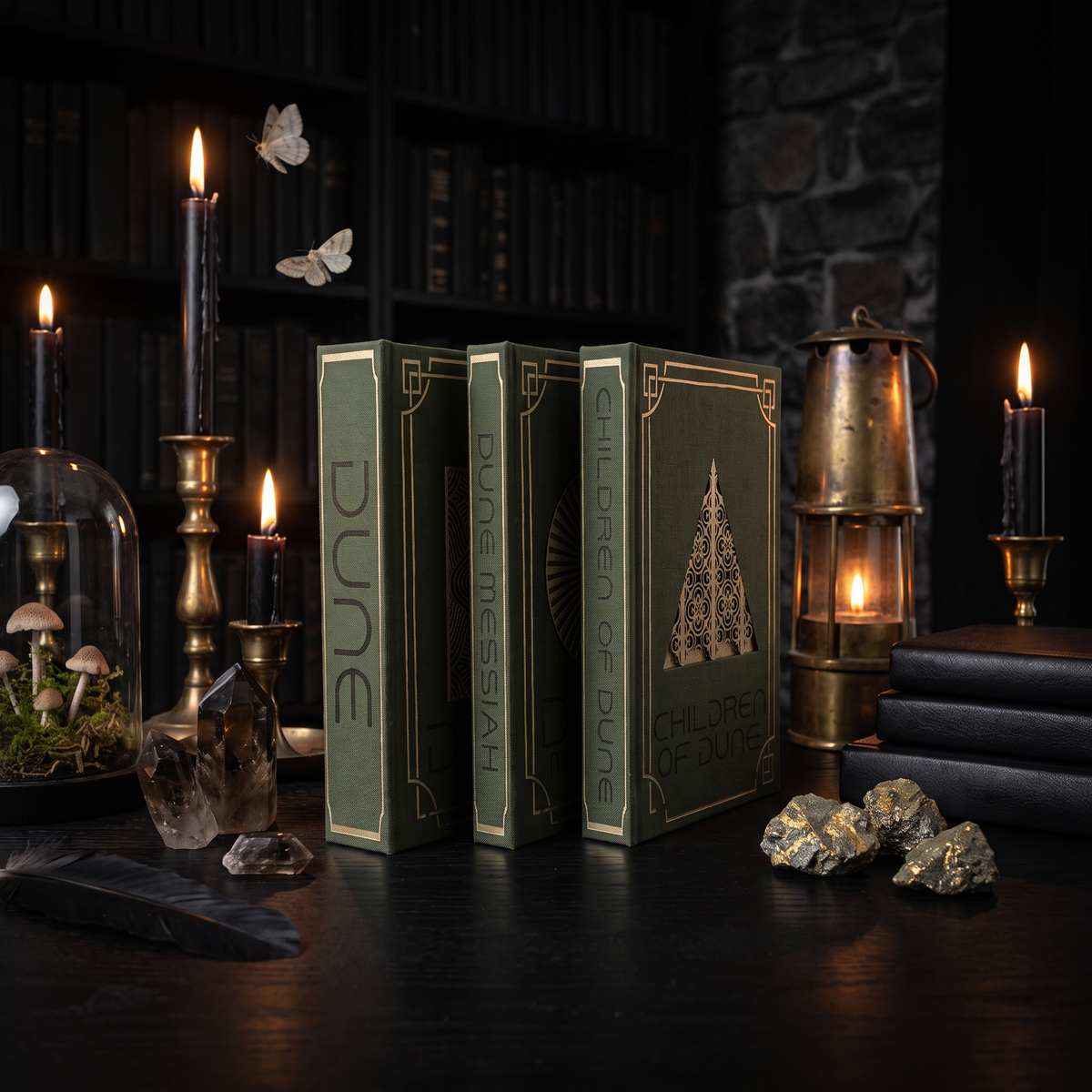 Dune trilogy set of three custom cloth-bound books, standing in a dark candlelit study